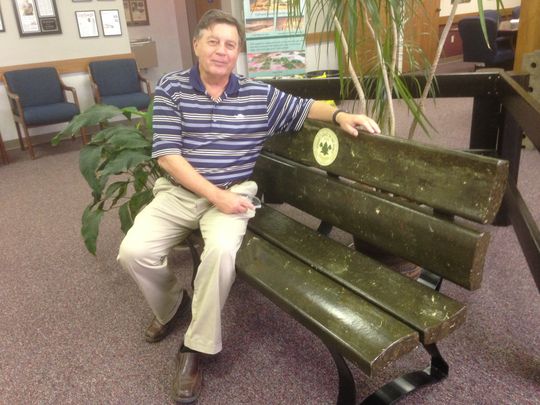 Terry Brown, the chief business development officer at the WastAway warehouse plant in Morrison, sits on a bench made from trash that the company recycles into a fluff product. (Photo: Scott Broden/DNJ)